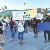 People rallying in protest against violence toward blacks march through Big Stone Gap Sunday.  KELLEY PEARSON PHOTO