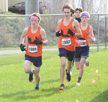 Seniors Asher Whitt (left), Ben Hersel (middle) and sophomore Dorian Almer (right) took the top three spots at the Region 2D meet Wednesday. PHOTO BY KELLEY PEARSON