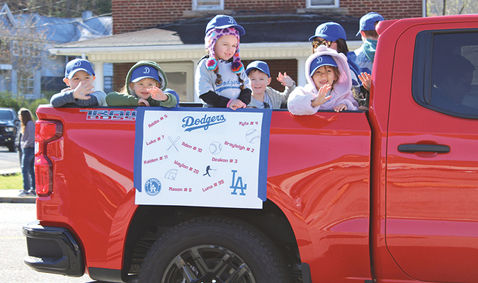 The Little League Dodgers wave and smile at the crowd during Saturday’s parade in Big Stone Gap.  KENNETH CROWSON PHOTO