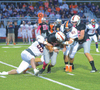 Colton Brown (55) and Brent Lovell (62) team up to get a big tackle Friday. PHOTO BY KELLEY PEARSON