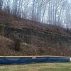 Some stones forming this retaining wall are falling into the river and near the baseball field.  TERRAN YOUNG PHOTO