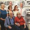 Former Post editor Bill Hendrick, seated with Sharon Daniels, was honored Saturday upon the exhibit of his photos donated to the Lonesome Pine School Heritage Center. Standing are Patti Lynn Cooper, Diane Hendrick Marks, Jerry Marks, Jamie Hendrick and Tim Trent.  MYRA MARSHALL PHOTO